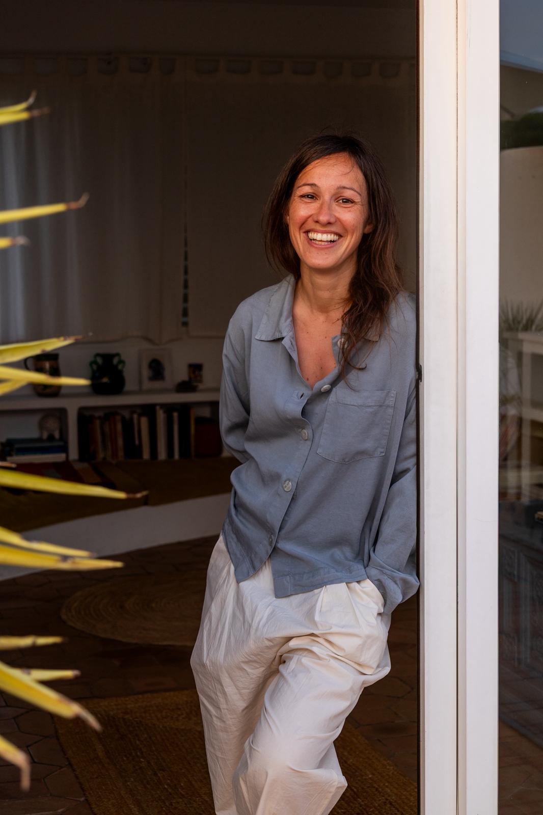Gemma Ferrer smiling in a doorway